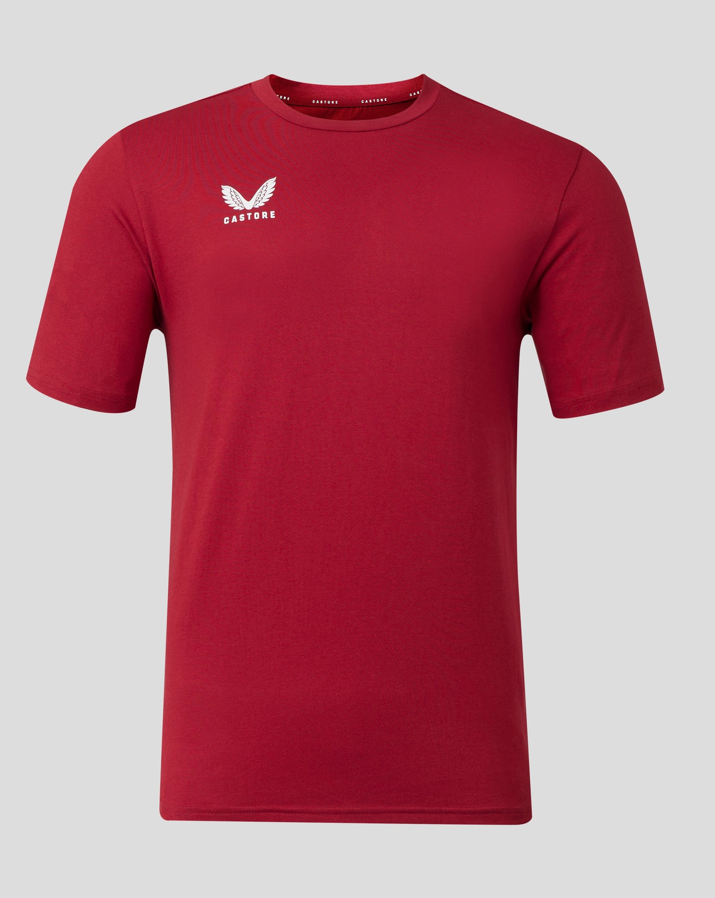 Front view of red Castore Men's Cotton Leisure Tee with white wing logo on left chest