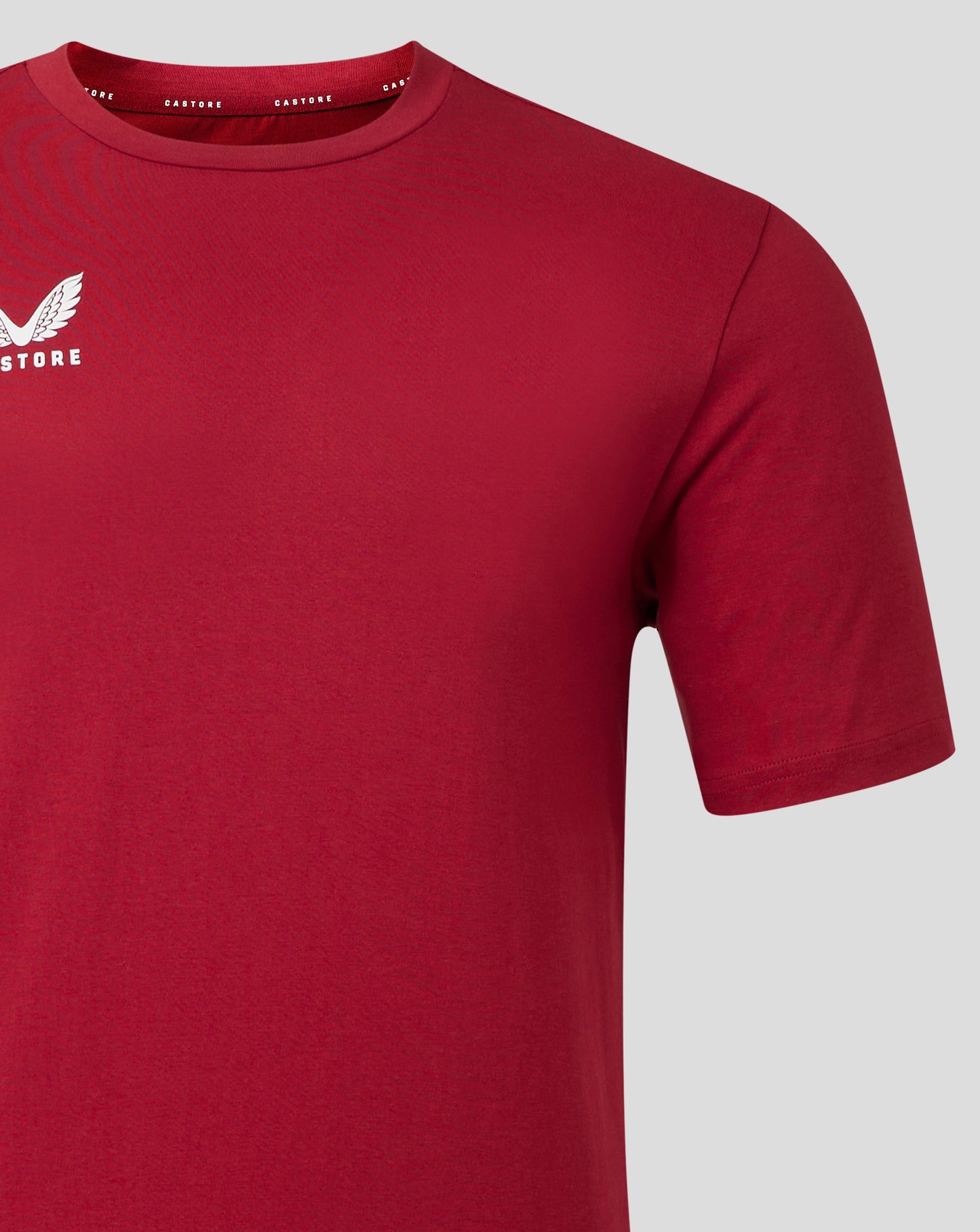 Close up of neckline and shoulder seam on red Castore Leisure Tee