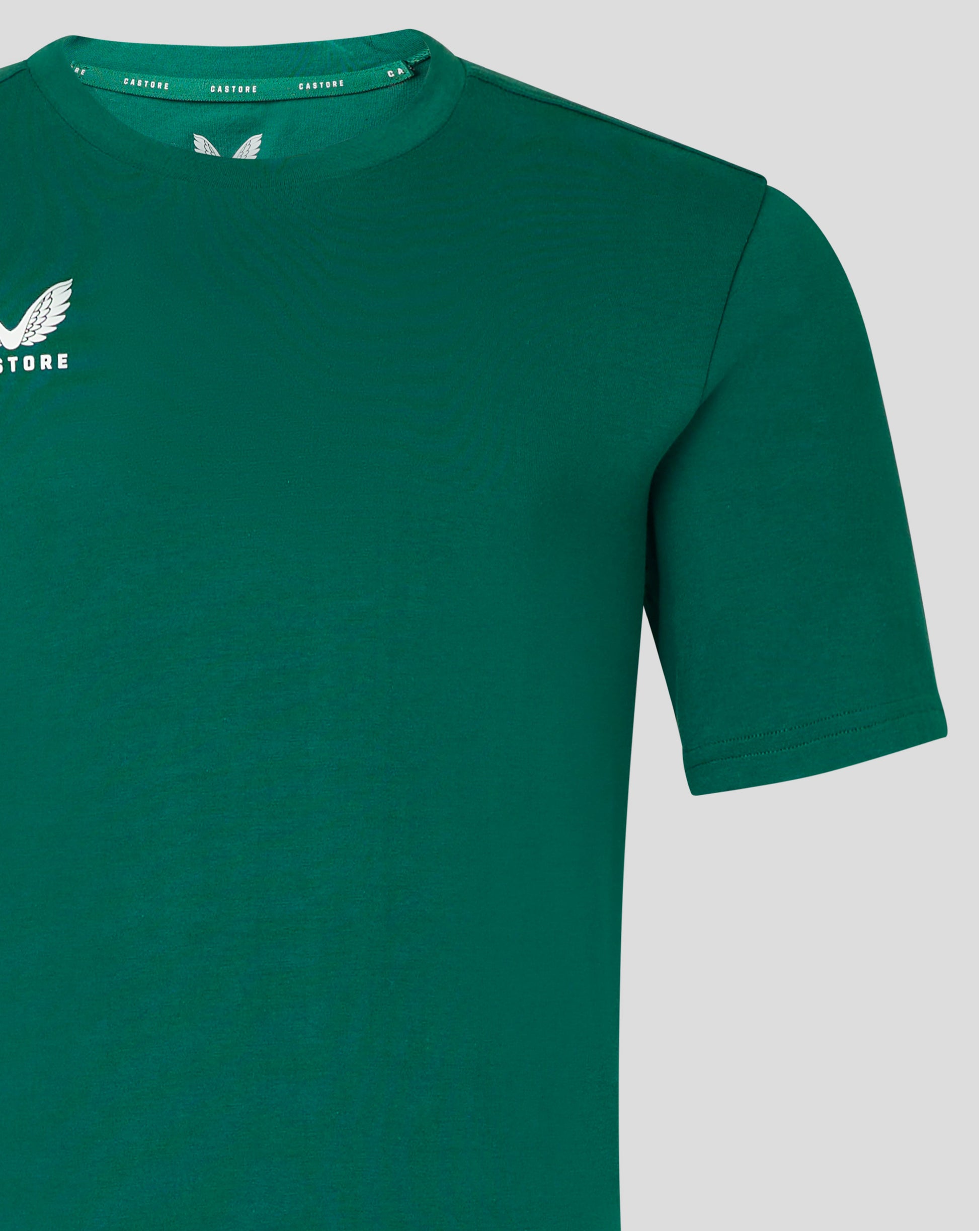 Green crew neck T shirt with forward shoulder seam and white Castore logo on the chest