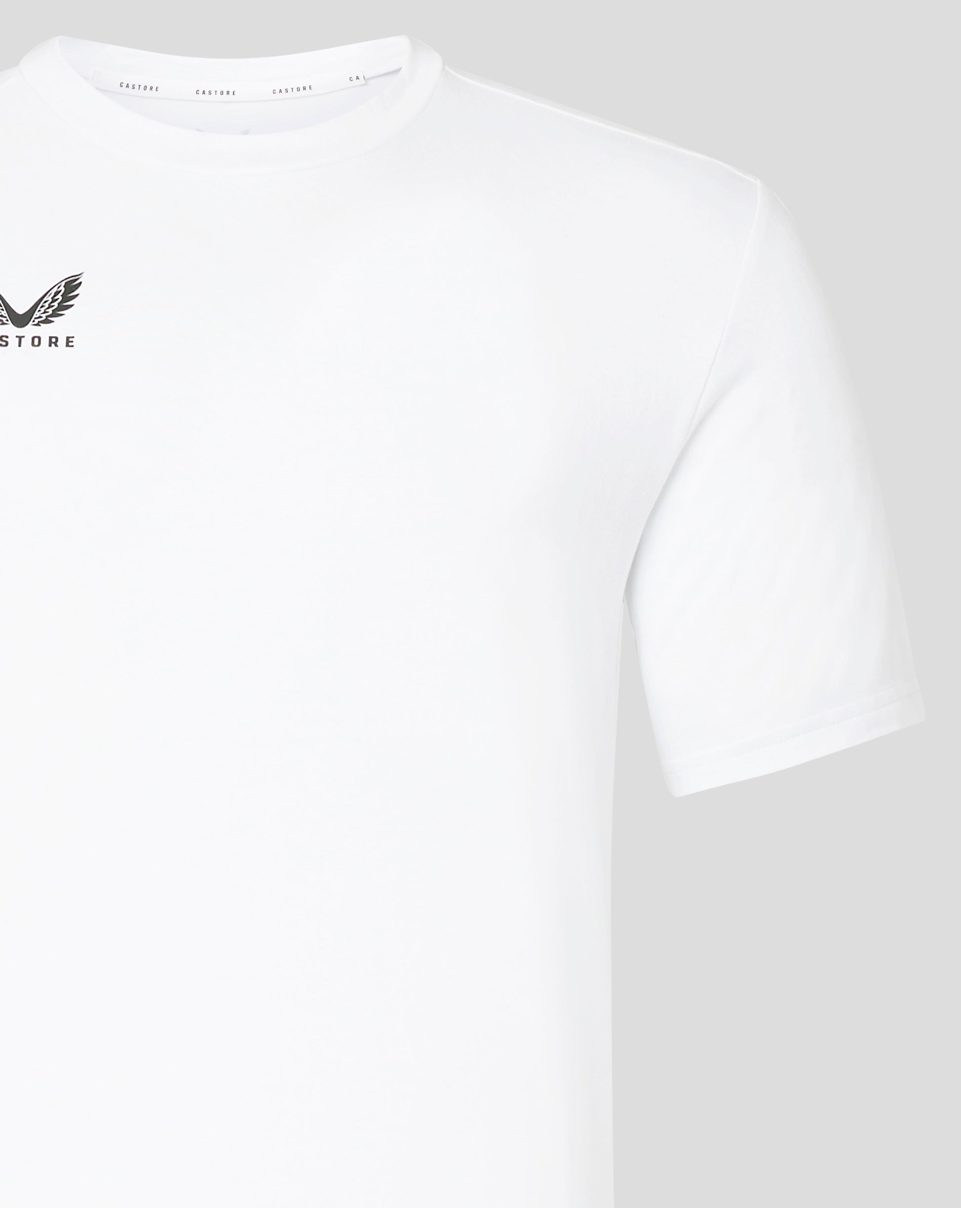 Close up of white Castore tee showing crew neck and branded inner collar tape
