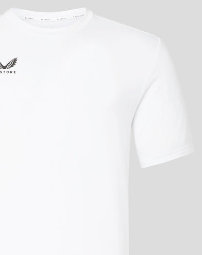 Close up of white Castore tee showing crew neck and branded inner collar tape