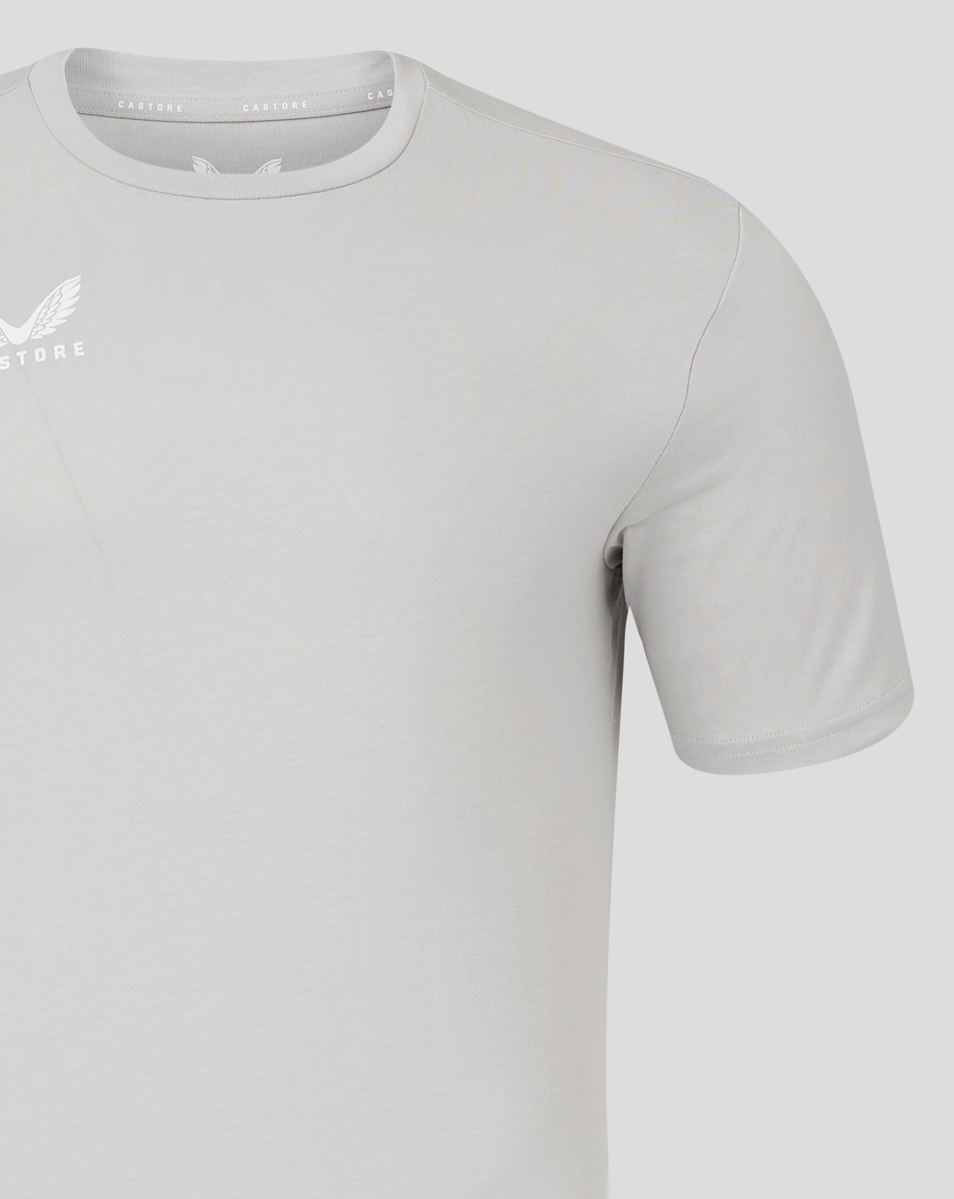 Close-up of neck and shoulder seam on light gray Men's Cotton Leisure Tee with Castore branding