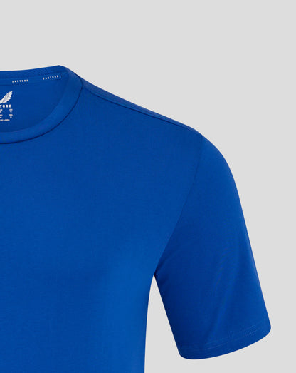 Shoulder and upper chest of blue Castore tee with visible white wing logo on the chest area