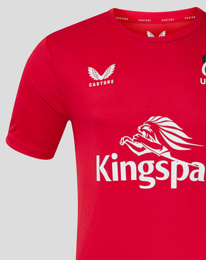 Close up of red ULSter training tee showing Castore logo on left chest and Ulster Rugby crest on right