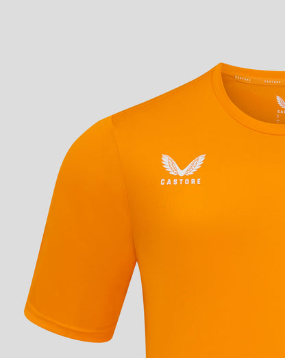 Close up of the orange tee neckline showing the Castore label along the inside and partial wing logo