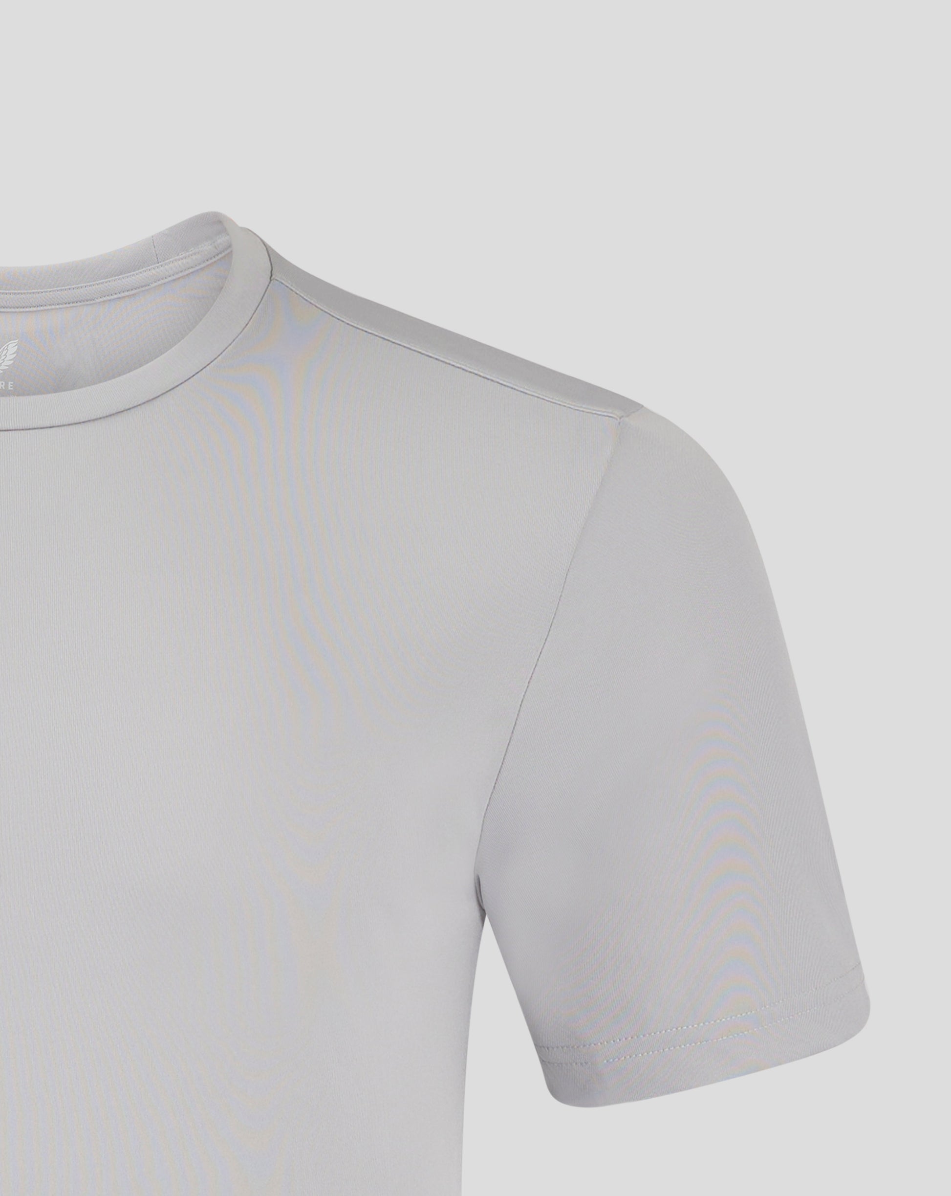 Close-up of light gray crew neck performance tee showing a shoulder seam and Castore logo.