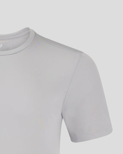 Close-up of light gray crew neck performance tee showing a shoulder seam and Castore logo.