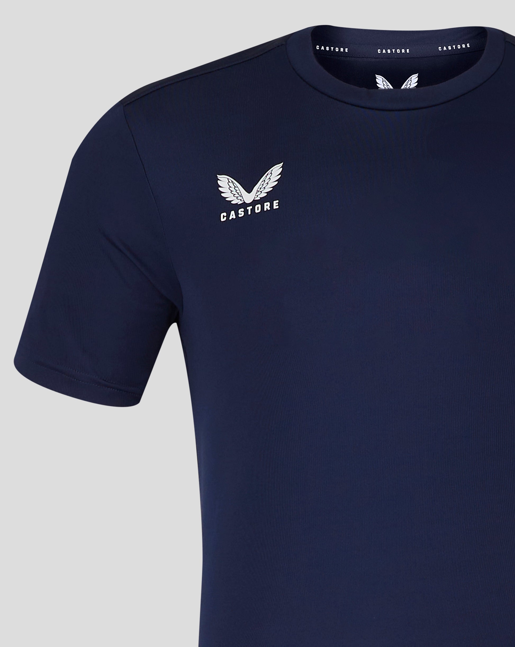 Navy tee featuring large white Castore wing emblem and logo on the chest