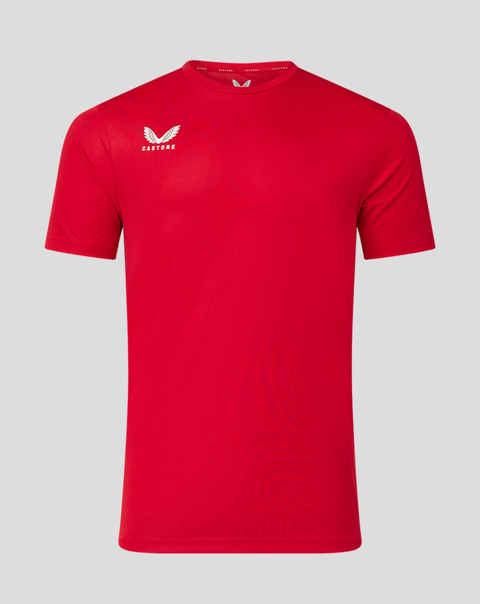 Red performance tee with a white Castore crest on the left chest