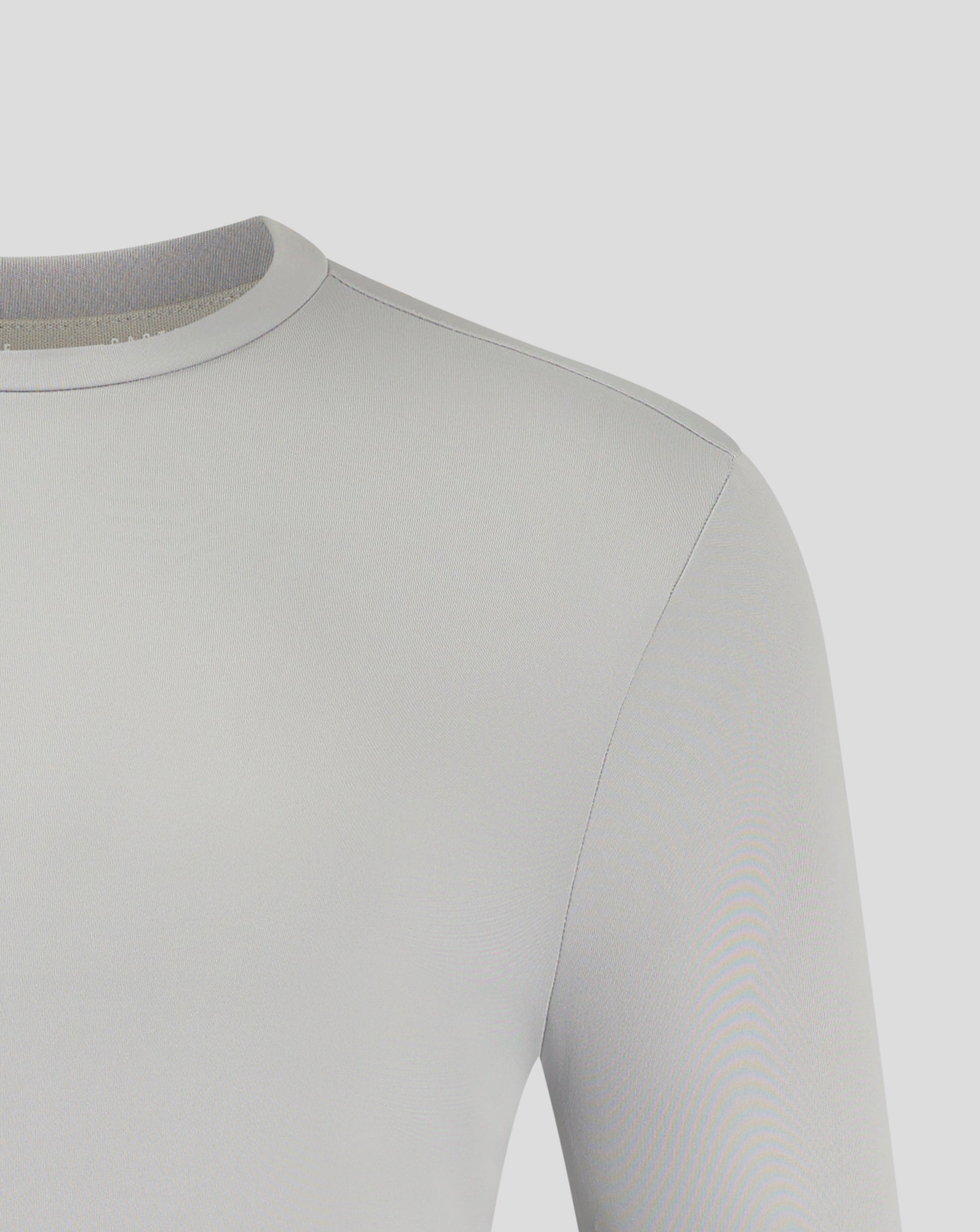 Upper shoulder and neckline detail on white performance tee