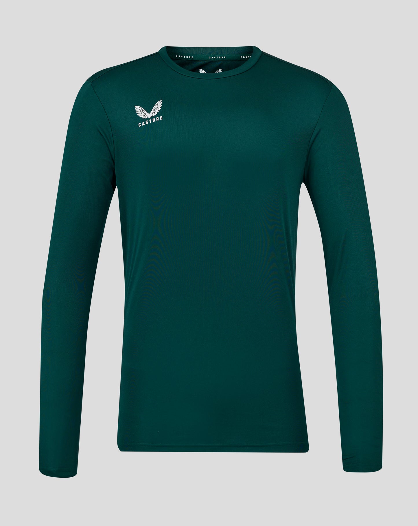 Botanical Garden teal long sleeve tee close up of chest showing white wing logo and Castore branding at the collar