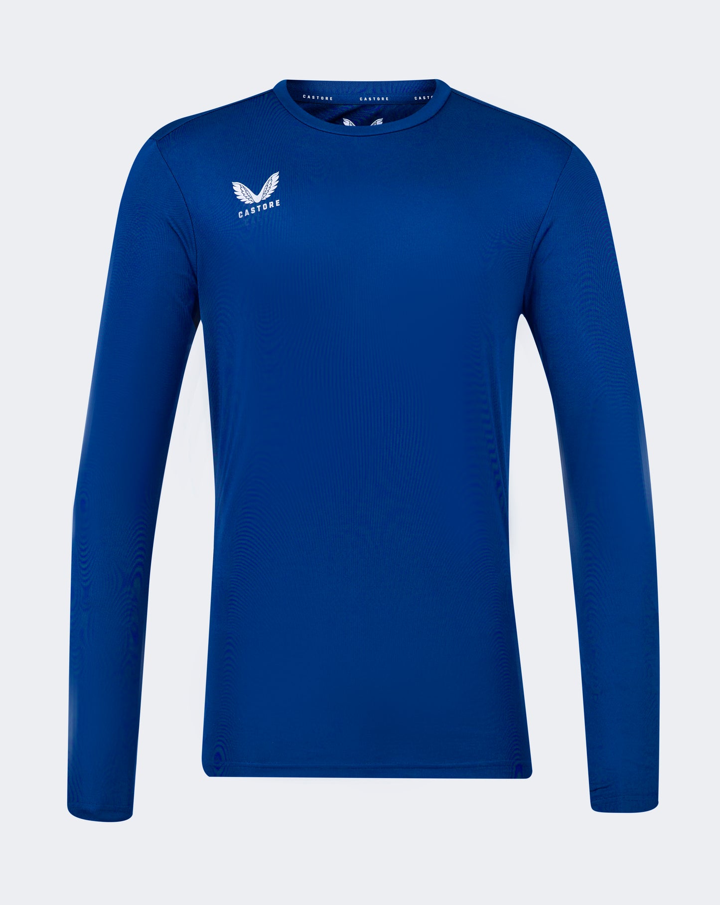 Blue long sleeve performance tee with crew neck forward shoulder seam and Castore logo