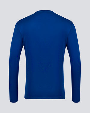 Rear view of blue long sleeve performance tee from Surf The Web collection on a light background