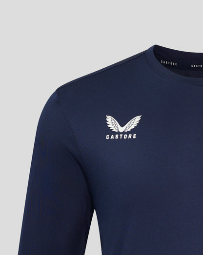 Close up of navy Peacoat long sleeve tee chest area with white Castore logo and wing emblem near the neckline