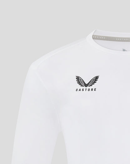 Close up of chest on white long sleeve training t shirt featuring a wing emblem and CASTORE branding