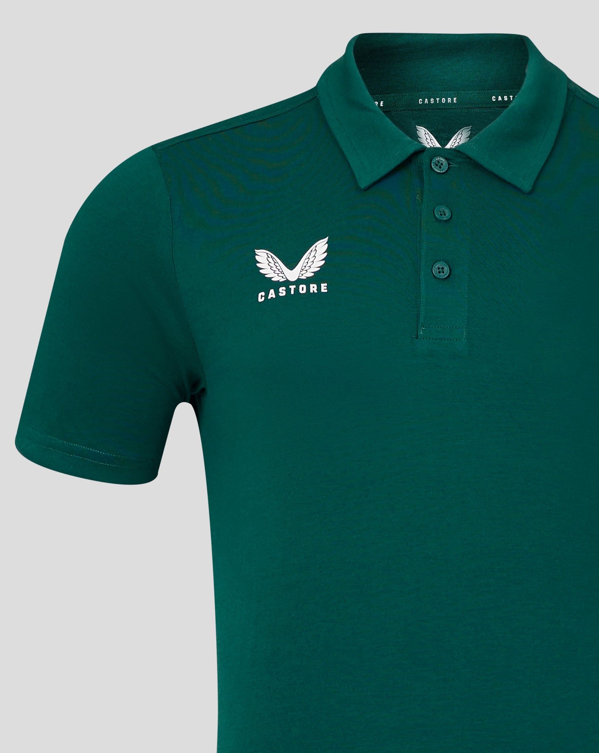 Upper back view of green botanical garden polo focusing on the collar
