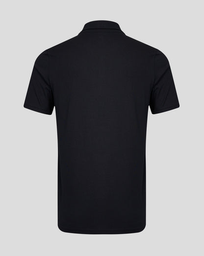 Rear view of a black polo shirt with a simple collar and short sleeves against a light gray background