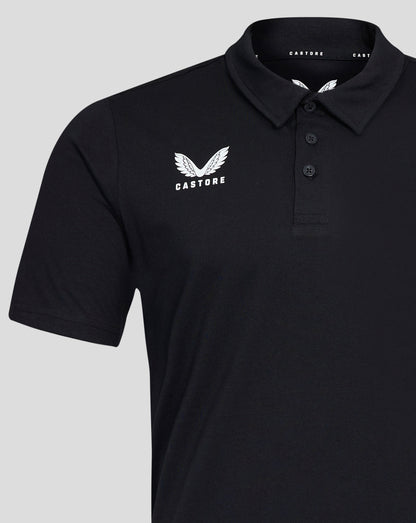 Close-up of the black polo chest showing the white Castore wing logo and the three button placket at the collar