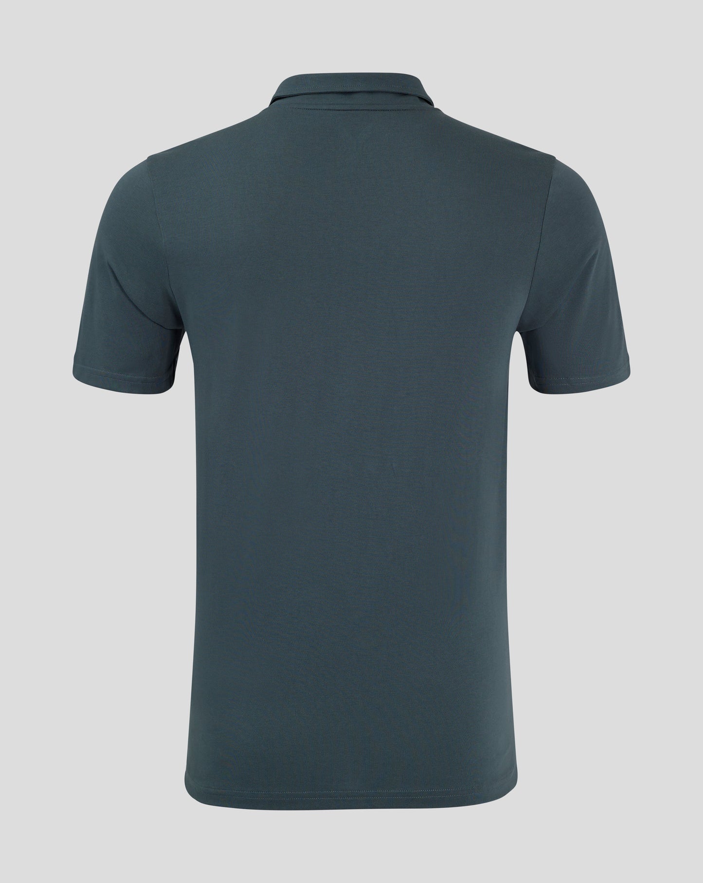 Back view of dark slate polo showing clean silhouette and heat sealed Castore logo at the neck