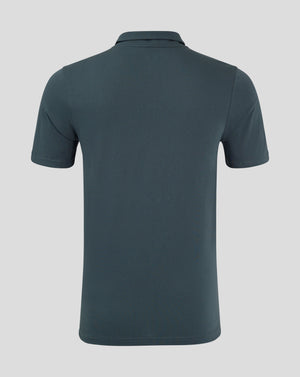 Back view of dark slate polo showing clean silhouette and heat sealed Castore logo at the neck