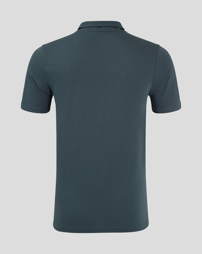 Back view of dark slate polo showing clean silhouette and heat sealed Castore logo at the neck