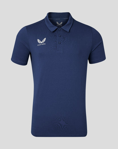 Back view of navy cotton leisure polo with soft collar and forward shoulder seam.