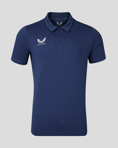 Back view of navy cotton leisure polo with soft collar and forward shoulder seam.