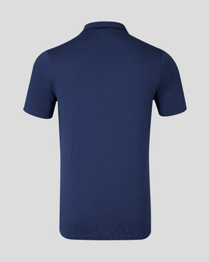 Front view of navy cotton leisure polo with three button placket and Castore logo on left chest.