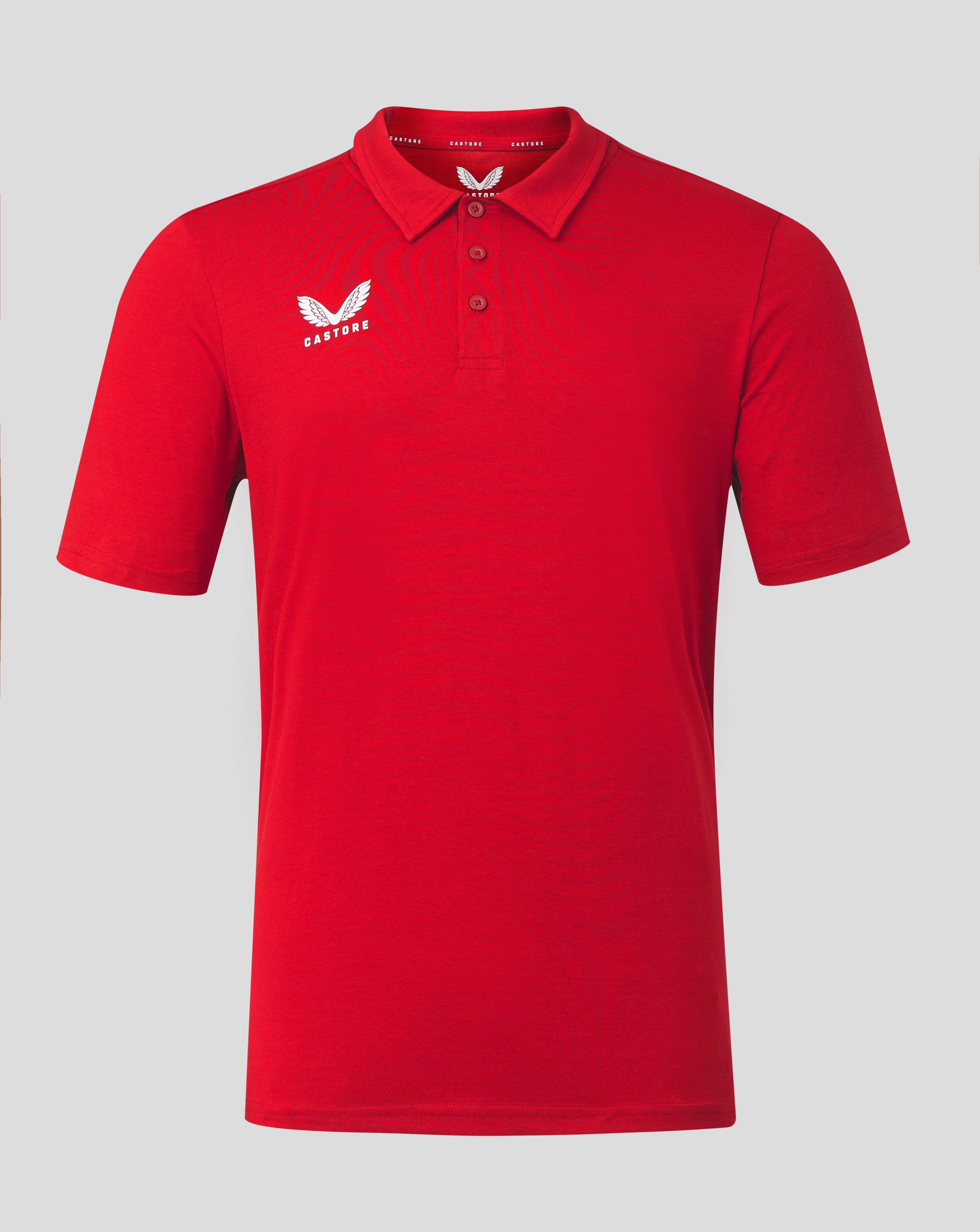 Front view of bright red Mens Cotton Leisure Polo with self fabric collar three button placket and Castore logo on chest.