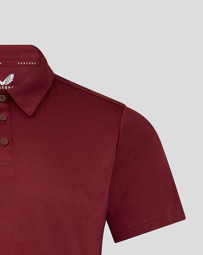 Polo shirt collar and shoulder close-up with three button placket and Castore branding