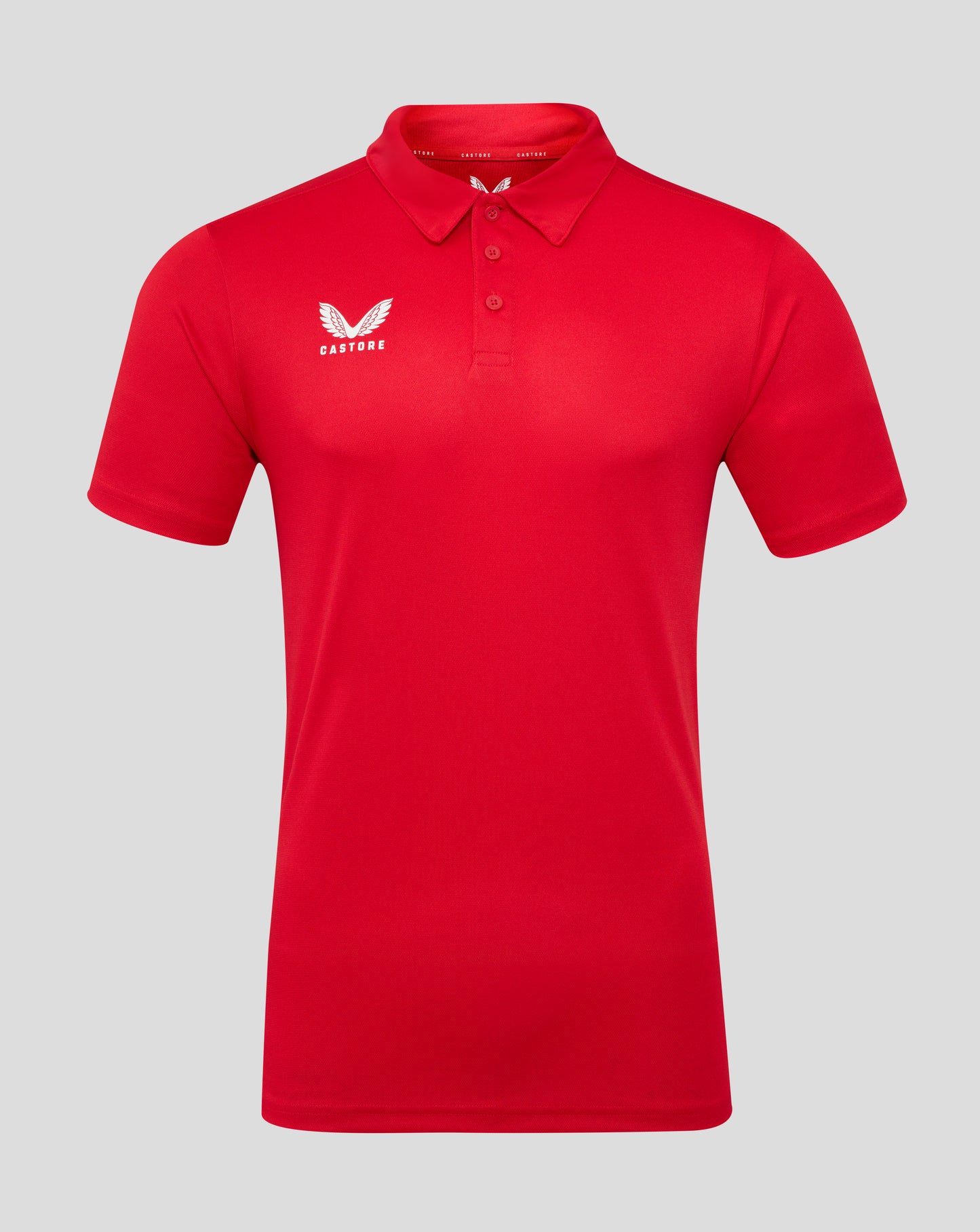 True red polo shirt with three button placket and Castore logo on the left chest.