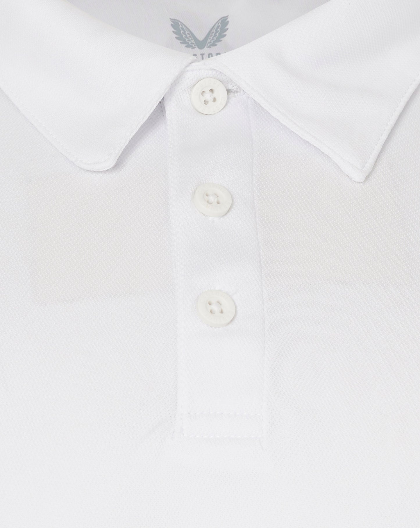 Rear view of white polo shirt showing collar and shoulder seam