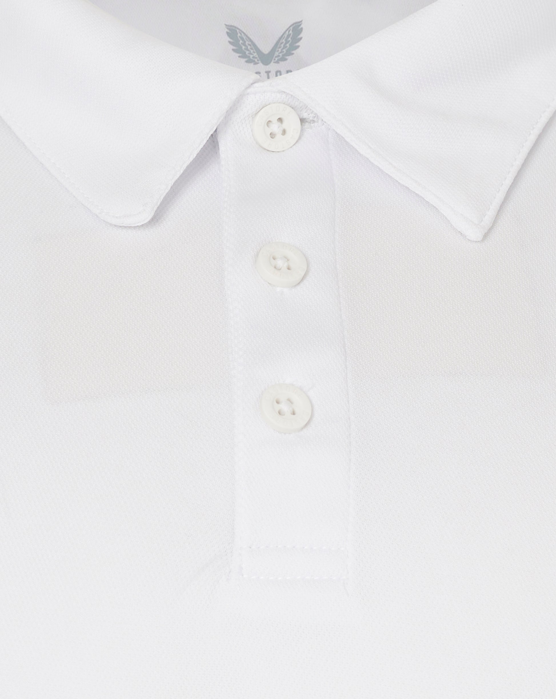 Close-up of a white shirt collar with a button placket and textured fabric.