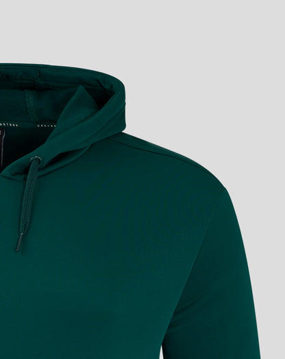 Shoulder and chest area of the green hoodie with a white wing logo on the chest.