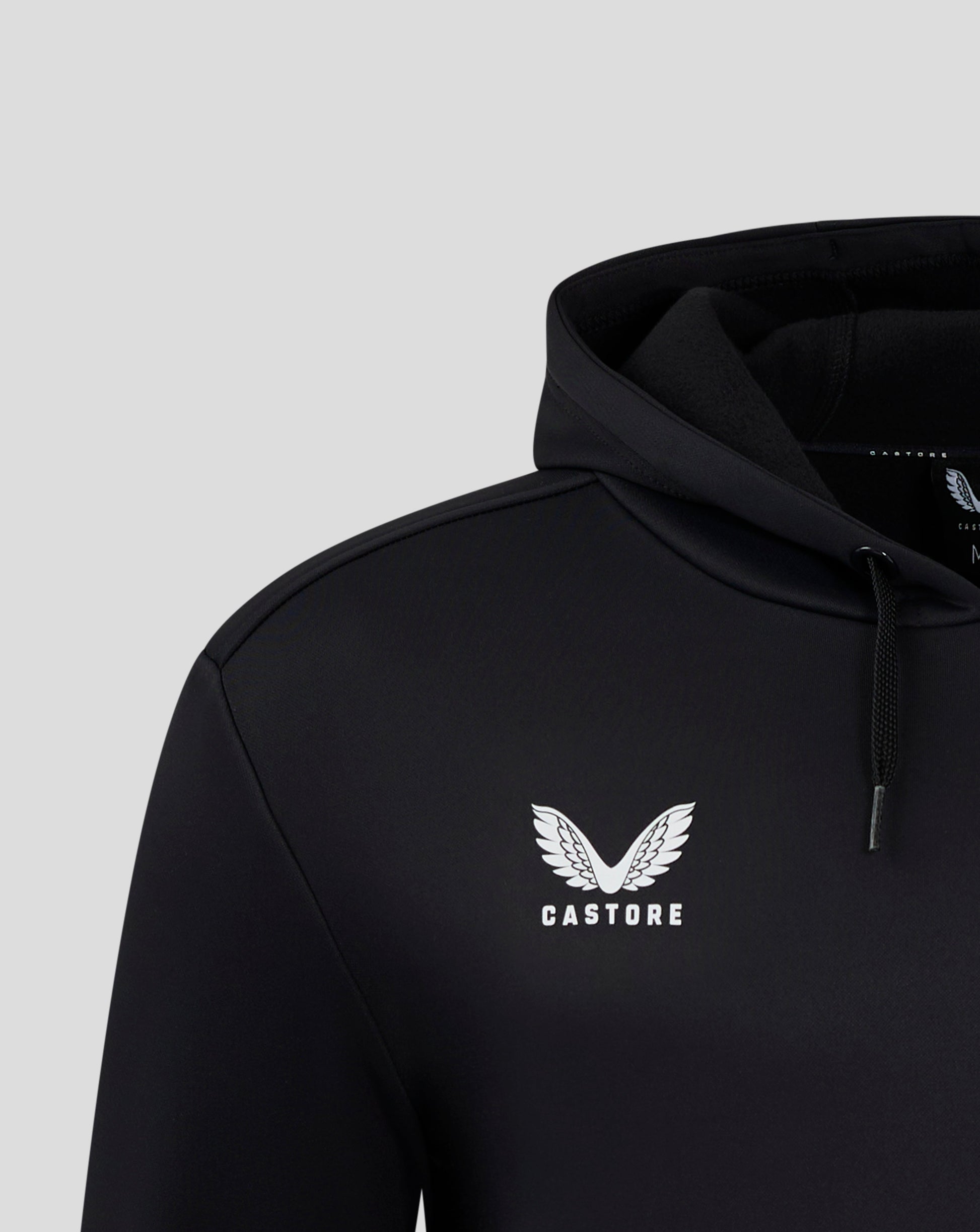 Close up of a black Mens Performance Overhead Hoodie showing the hood edge and Castore logo.