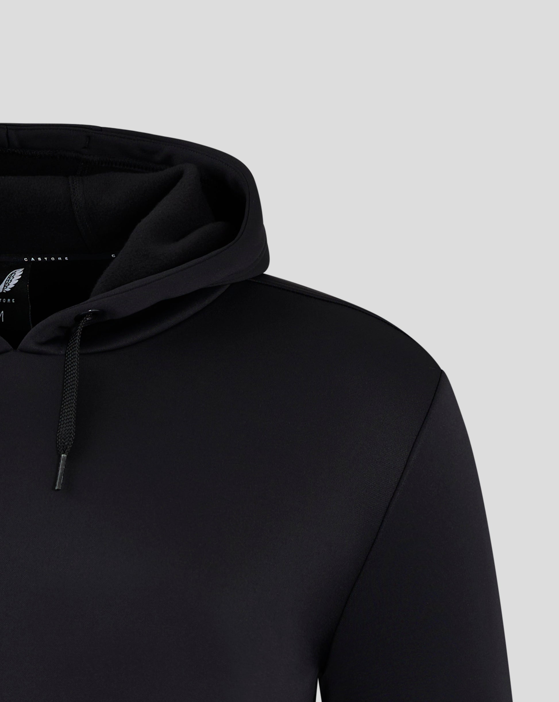 Partial view of black hooded sweatshirt showing the hood and drawstring.