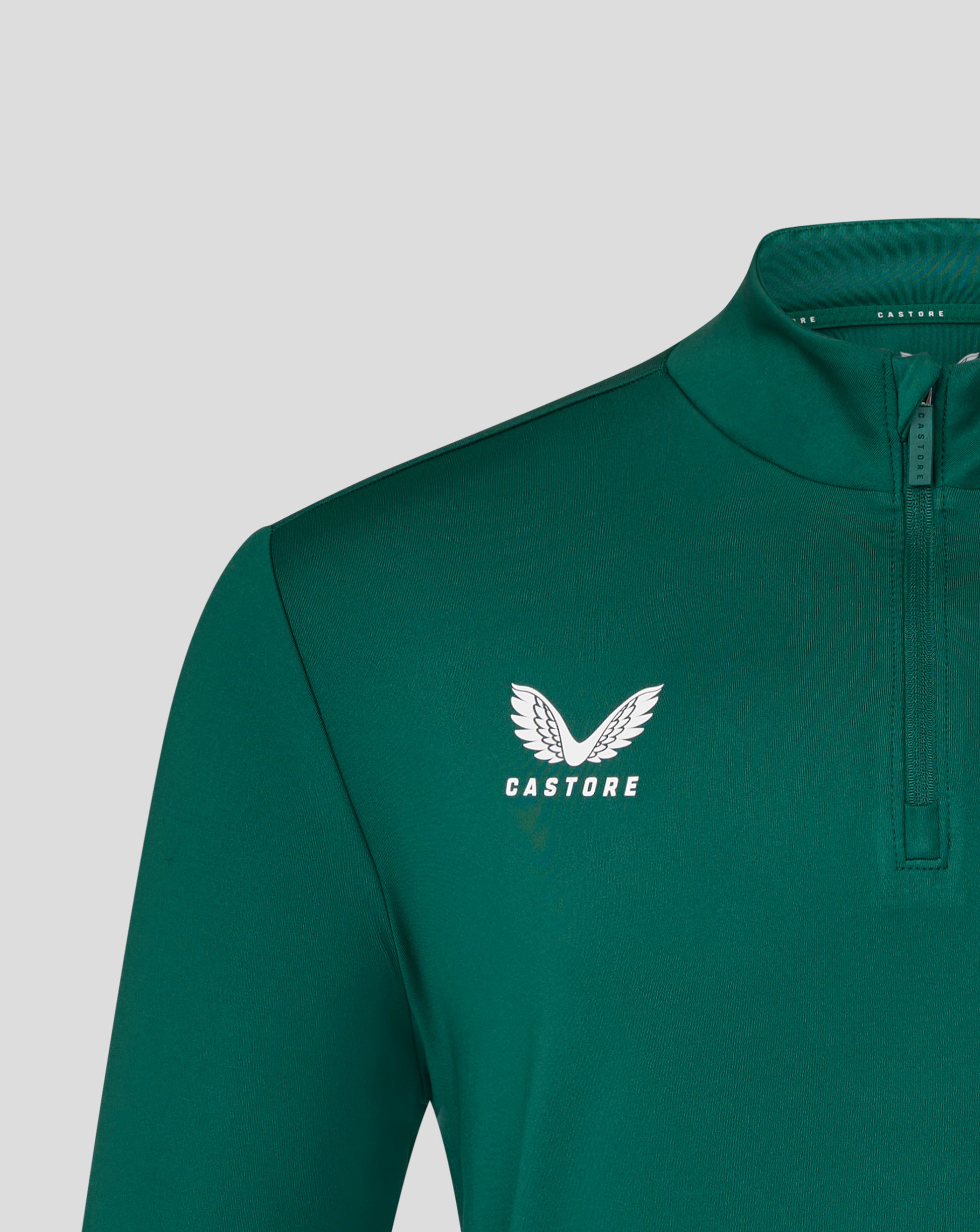 Teal Leicester Tigers training midlayer close up with white Castore wing logo and front zipper detail.
