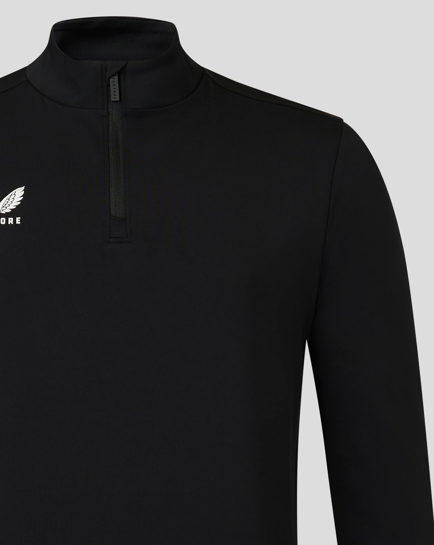 Close up of black mens 1/4 zip top with funnel neckline and white Castore logo on chest