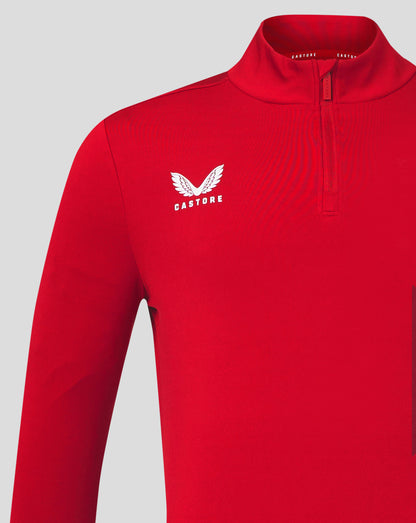 Close up of red quarter zip top chest showing white Castore logo and zip placket at funnel collar