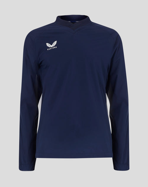 Front view of navy rugby top with white Castore wing logo on left chest and ribbed V neck