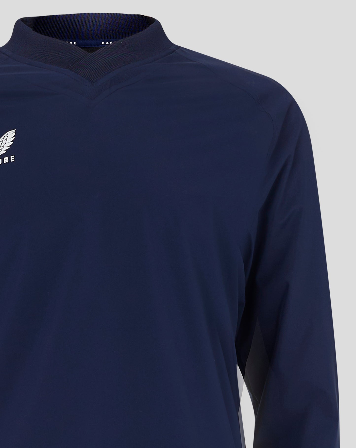 Navy Mens Rugby Top close up showing ribbed V neck collar and Castore wing logo on chest