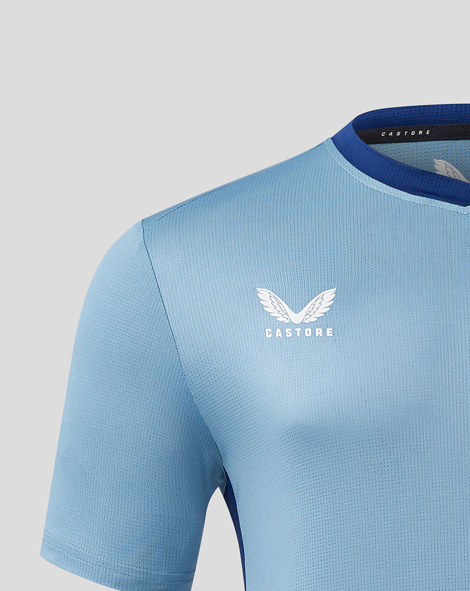 Close up of the light blue jersey chest showing Castore branding near the collar
