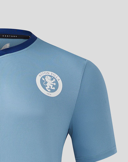 Front upper chest of light blue jersey with Aston Villa crest on the left and navy neckline trim
