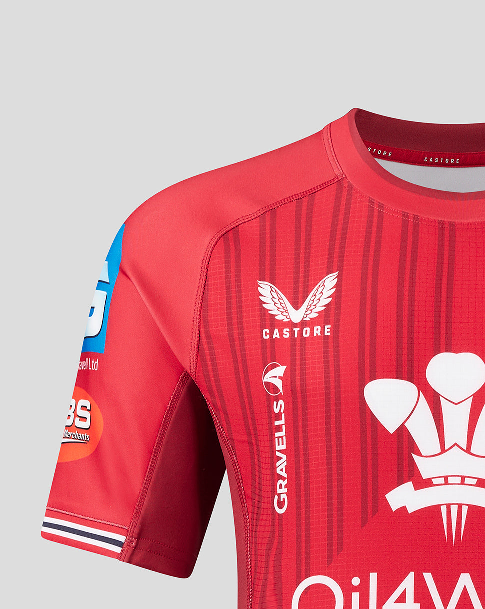 Scarlets home Pro Shirt 23/24 front view in red with multi angled vertical stripes, club crest on left chest and Castore branding on right.