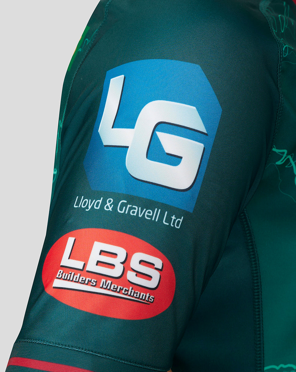 Scarlets away shirt sleeve featuring Lloyd & Gravell Ltd and LBS Builders Merchants sponsor patches.