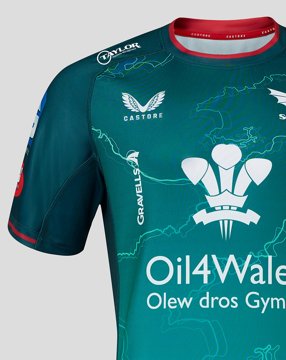Scarlets away shirt close up front featuring crest and GRAVELLS vertical text on teal patterned fabric