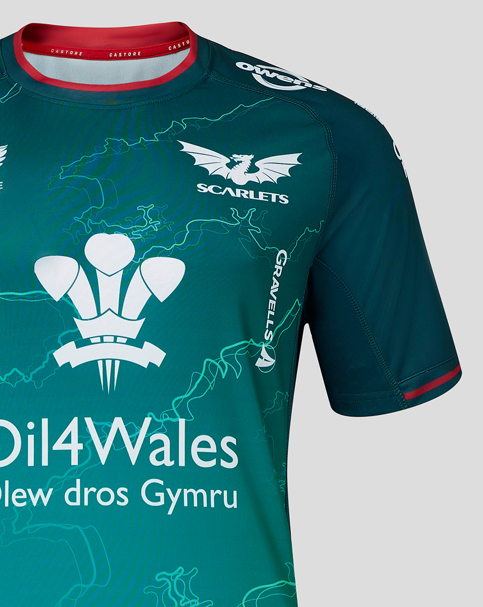 Teal Scarlets away shirt close up showing club crest on left chest and Castore branding on right