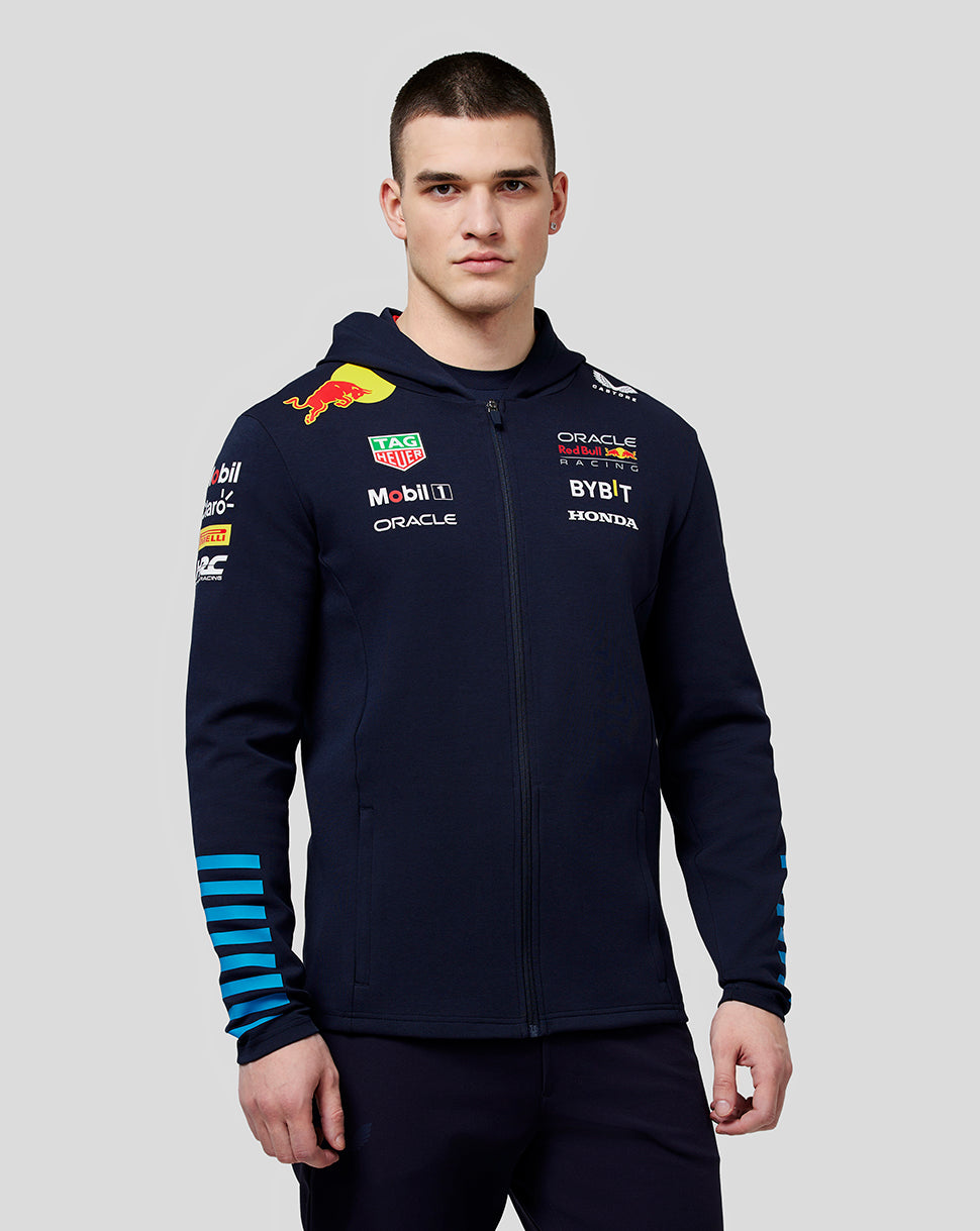 Male model wearing navy Oracle Red Bull Racing hoodie with sponsor logos on chest and sleeves