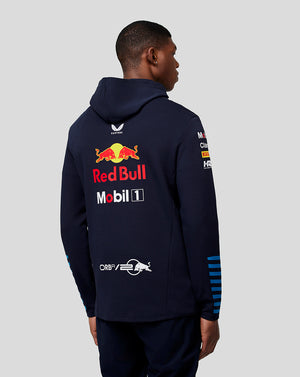 Back view of a model wearing a navy Oracle Red Bull Racing Teamline hoodie with bold Red Bull and sponsor graphics on the back