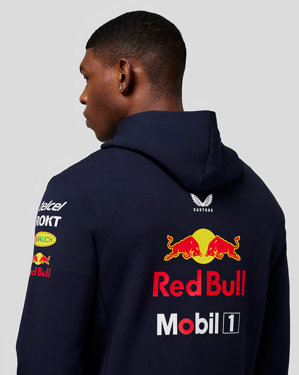 Back view of navy Oracle Red Bull Racing hoodie on a model with large Red Bull emblem on back and sleeve logos.